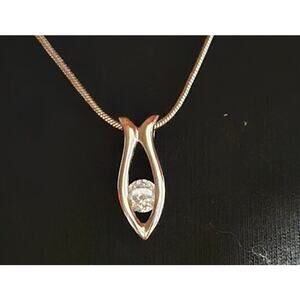 Silver teardrop shaped pendant necklace with translucent gemstone